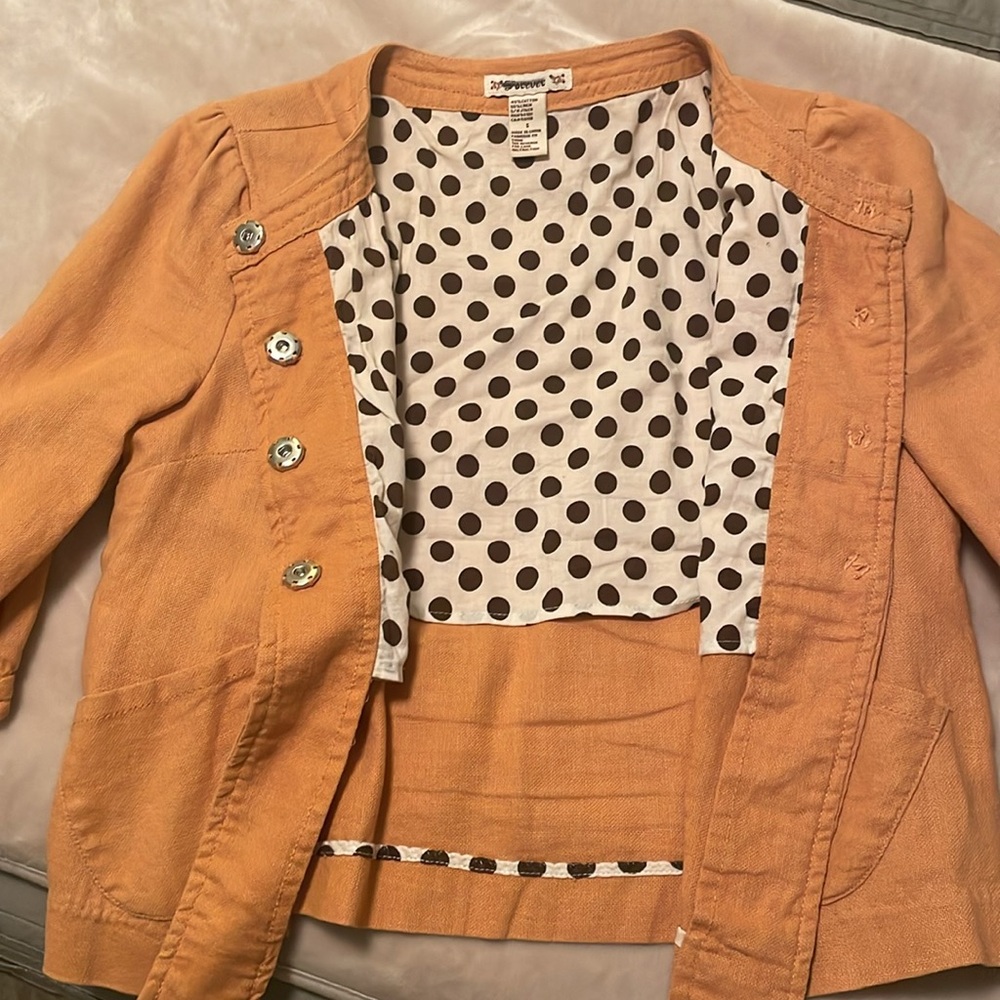 Cute 3/4 sleeve jacket size small. Large button snaps at front and sleeves